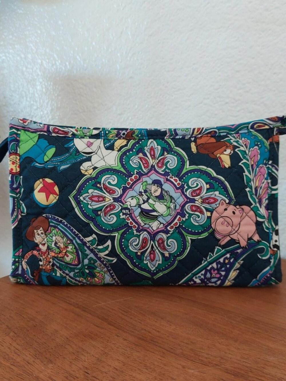 vera bradley Disney Toy Story quilted pouch with characters in a paisley design